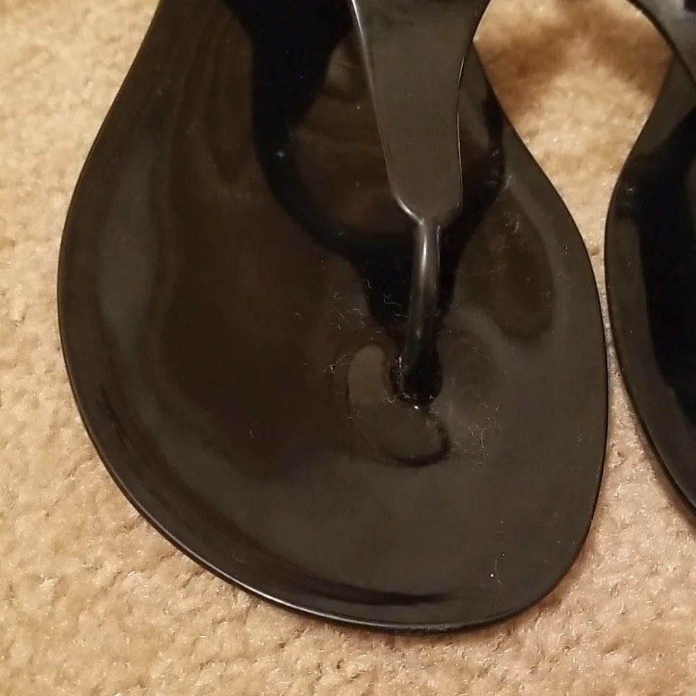 Michael Kors Black Jelly Thong Sandals with Gold Padlock Accent